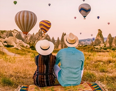 Couple watching hot air balloons